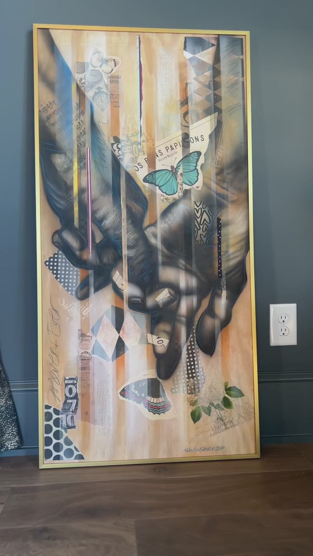 Mixed media painting on wood of clasped hands with butterfly, rose, and vintage collage – faith and hope artwork.